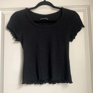 Solid black short sleeve ruffle shirt